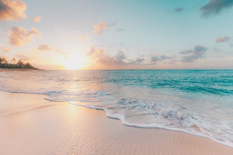 Sunset over a calm sandy beach